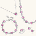 Pink heart-shaped cubic zirconia jewelry set with white gold plating featuring necklace, earrings, bracelet and ring