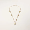 14K gold plated necklace with organic leaf motifs and freshwater pearls arranged in an elegant chain design on neutral background.