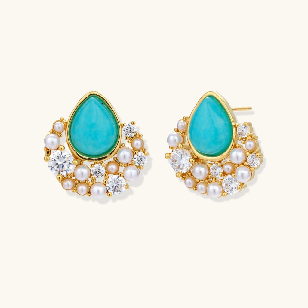 Gold-plated cluster earrings with teardrop turquoise stones surrounded by white pearls and clear crystals