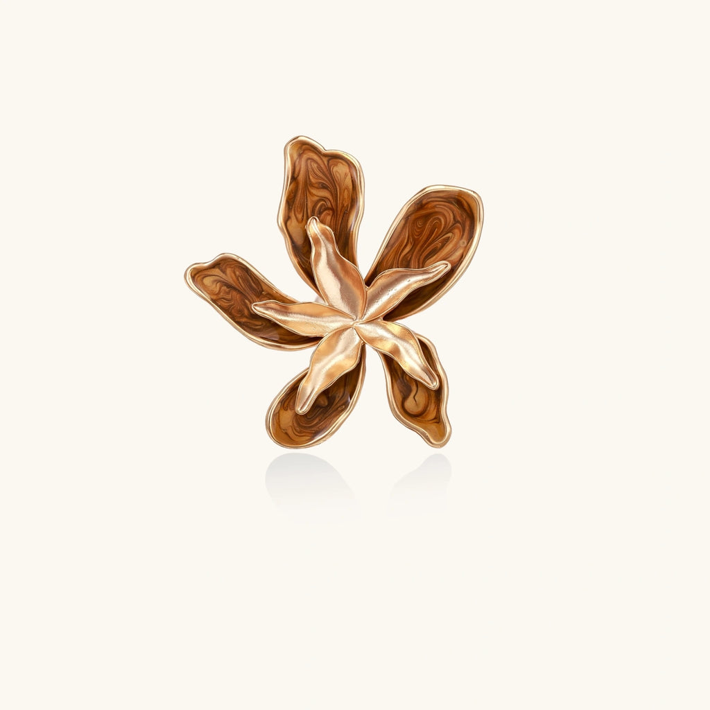 Large rose gold ring with marbled brown enamel petals in a sculptural flower design